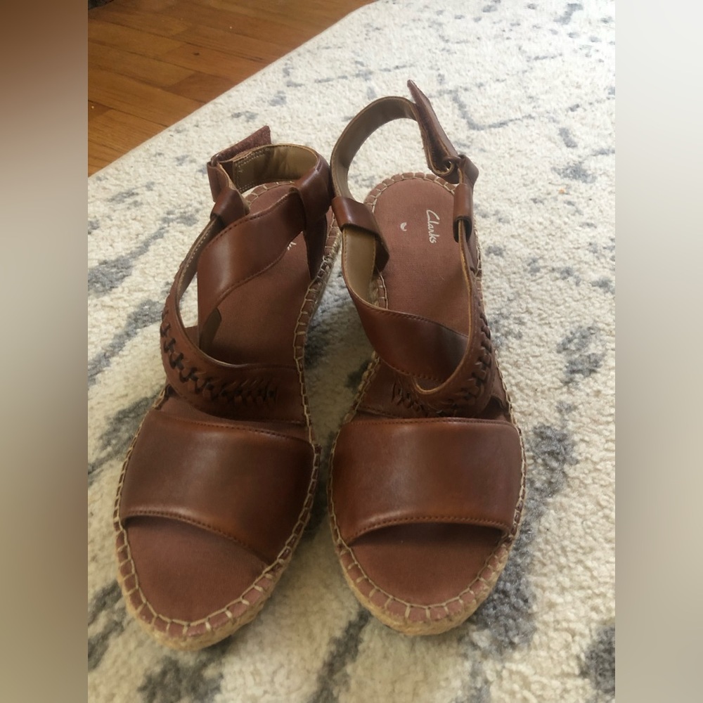 Brand new Clark’s brown peep toe wedges